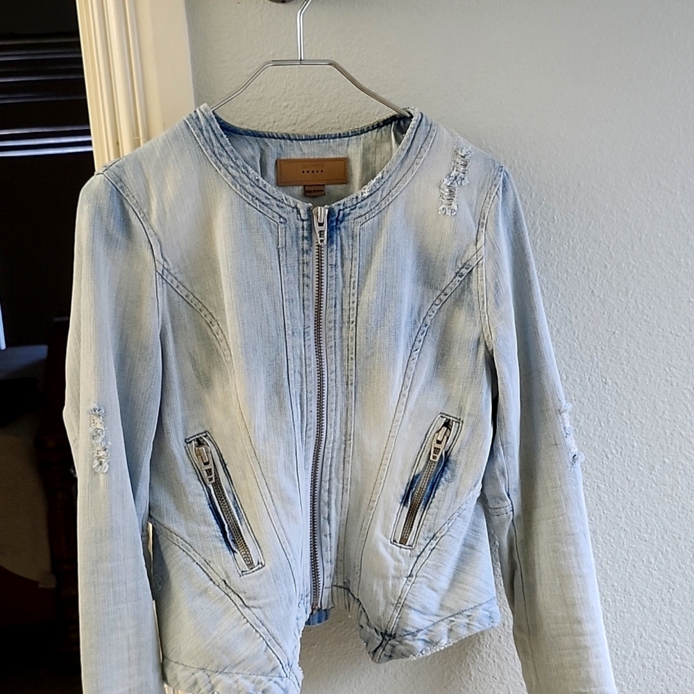 Distressed light wash denim jacket